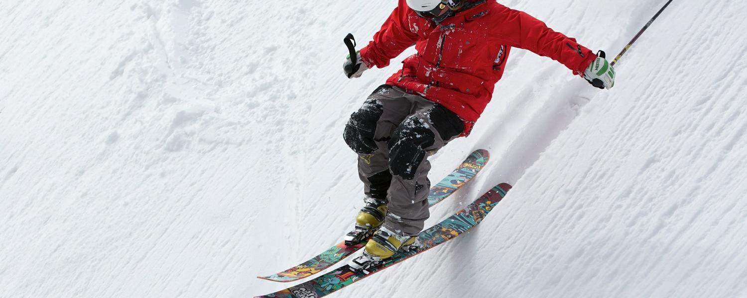 alpine skier on a steep snowy slope