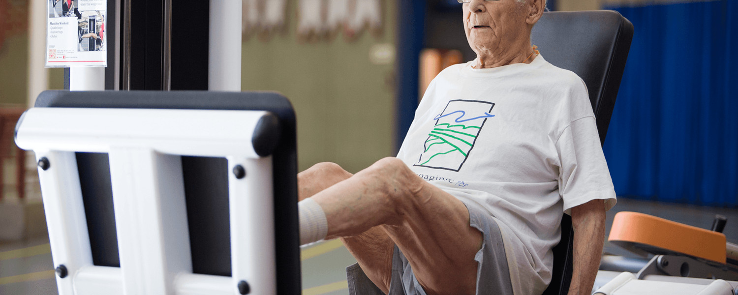 eldery man doing leg press exercise at the university of calgary