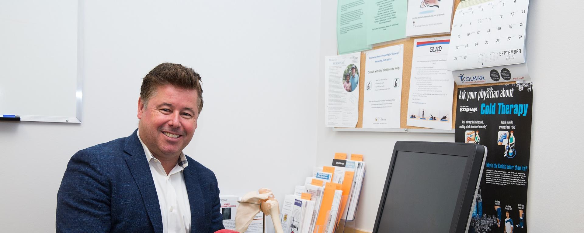 Dr. Richard Boorman demonstrates shoulder injury with model